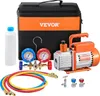 A collection of HVAC tools including a vacuum pump, manifold gauge set, hoses, and a carrying bag, arranged on a white background. Voir les images du produit