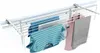 A white drying rack with clothes hanging on it, against a white background. Podgląd zdjęcia produktu