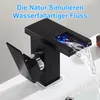 A black waterfall faucet with blue LED lights is shown in a bathroom sink, with water flowing. Produktbild-Vorschau