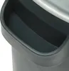 A close-up view of the handle and top edge of a dark gray electric grain mill. Podgląd zdjęcia produktu