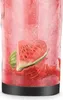 A close-up of a blender cup with a watermelon slice and splash inside, against a pink, icy background. Voir les images du produit