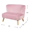 A pink velvet children's sofa with wooden legs, shown from the front with dimensions indicated. Voir les images du produit