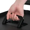 A hand is gripping a black handle of a black object. Produktbild-Vorschau