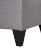 A close-up view of the bottom corner of a gray upholstered furniture piece, showing its black legs. Produktbild-Vorschau
