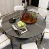 A dining table set with chairs, a pitcher of drink, cups, and fruit. Anteprima dell’immagine prodotto