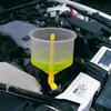 A coolant filling funnel set is being used to add yellow coolant to a car engine. Podgląd zdjęcia produktu