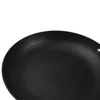 Close-up view of the interior of a black frying pan. Podgląd zdjęcia produktu