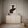 A modern living room with a sideboard, artwork, and decorative items. Voir les images du produit