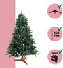 A green artificial Christmas tree with a wooden stand, presented against a split pink and white background, with informational icons on the right. Produktbild-Vorschau