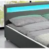 Close-up of a modern bed with a grey headboard featuring blue and green LED lighting. Náhled obrázku produktu