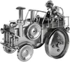 A metallic sculpture of a tractor with a driver and a dog, presented against a white background. Anteprima dell’immagine prodotto