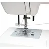 Close-up view of the needle and presser foot area of a white sewing machine. Produktbild-Vorschau