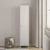 A tall, white metal locker stands against a light gray wall, next to a window with white curtains. A black wire basket filled with blankets is placed to the left of the locker. Produktbild-Vorschau