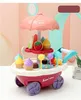 A toy ice cream cart with various ice cream cones and lollipops displayed. Produktbild-Vorschau