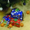 Christmas presents under a tree with tangerines. Produktbild-Vorschau