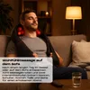 A man is relaxing on a couch while using a neck and shoulder massager. Produktbild-Vorschau