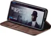 A smartphone in a brown flip case is displayed, showing a movie poster on its screen. Produktbild-Vorschau