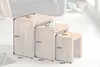 A set of three nesting tables with dimensions indicated by measurement lines and text. Produktbild-Vorschau