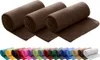 Multiple rolled-up fleece blankets in brown on top, and a row of rolled-up fleece blankets in various colors below. Produktbild-Vorschau