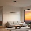 A modern living room with a sectional sofa, coffee table, rug, and a large window showing a sunset. Produktbild-Vorschau