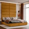 A bedroom scene with a large upholstered headboard and bed. Anteprima dell’immagine prodotto