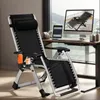 A black zero gravity chair is set up next to a desk with a computer and tablet, suggesting a home office or relaxation space. Náhled obrázku produktu
