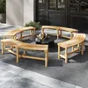 A curved wooden bench set arranged around a circular coffee table on an outdoor patio. Anteprima dell’immagine prodotto