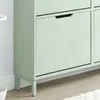 A close-up view of a light green shoe cabinet with a handle on one of its doors. Produktbild-Vorschau