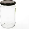 A clear glass jar with a black lid, isolated on a white background. Podgląd zdjęcia produktu