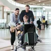 A family at an airport with luggage. Náhľad obrázku produktu