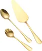 A set of gold-colored cutlery, including a cake server and two spoons, arranged on a white background. Náhľad obrázku produktu