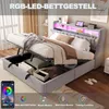 A bed with its storage compartment open, showing the interior and some stored items. The headboard has LED lighting. Produktbild-Vorschau