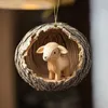 A wooden sheep ornament inside a hollowed-out log, hanging from a string. Produktbild-Vorschau
