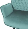 Close-up of a teal velvet armchair. Náhled obrázku produktu