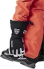 A person wearing ski gear, including ski pants and boots, with a glove on their hand. Náhľad obrázku produktu