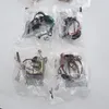 Several small toy accessories are individually packaged in clear plastic bags, arranged in a grid on a white surface. Náhľad obrázku produktu