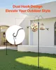 A black shepherd's hook with a basket of flowers and a bird feeder hanging from it, in a grassy yard with a white building in the background. Produktbild-Vorschau