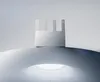 A white Xiaomi router with four antennas is placed on a curved surface with a bright light source underneath. Náhľad obrázku produktu