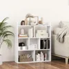 A white bookshelf filled with decorative items and books, placed in a room next to a sofa. Podgląd zdjęcia produktu