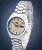 A close-up studio shot of a silver Seiko automatic watch against a blue background. Produktbild-Vorschau
