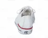 A white sneaker with red and blue accents is shown from the back. Produktbild-Vorschau