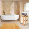 A modern bathroom with a freestanding bathtub, a bamboo laundry basket, and towels. Podgląd zdjęcia produktu