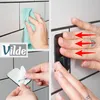 Collage showing steps for installing a toilet paper holder. Anteprima dell’immagine prodotto