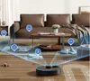 A robot vacuum cleaner is shown on a wooden floor in a living room with a sofa and coffee table. The vacuum is depicted with blue light projections indicating its scanning and mapping capabilities, highlighting objects like shoes, furniture, and an electri Náhled obrázku produktu