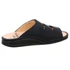 A side view of a navy blue slide sandal. Produktbild-Vorschau