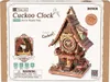The image shows the packaging of a ROKR 3D-Holz-Puzzle Kuckucksuhr, featuring a detailed illustration of the assembled cuckoo clock and product information. Náhľad obrázku produktu