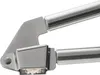 A close-up shot of a stainless steel garlic press with some crushed garlic in the press. Náhľad obrázku produktu