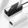 Two Ugreen network adapters, one black and one white, are displayed on a white and light gray background. Voir les images du produit