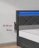 A close-up shot of a modern upholstered bed frame with integrated LED lighting and side storage compartments. Náhled obrázku produktu