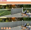 A balcony with a grey privacy screen installed along the railing, with outdoor furniture and plants. Podgląd zdjęcia produktu